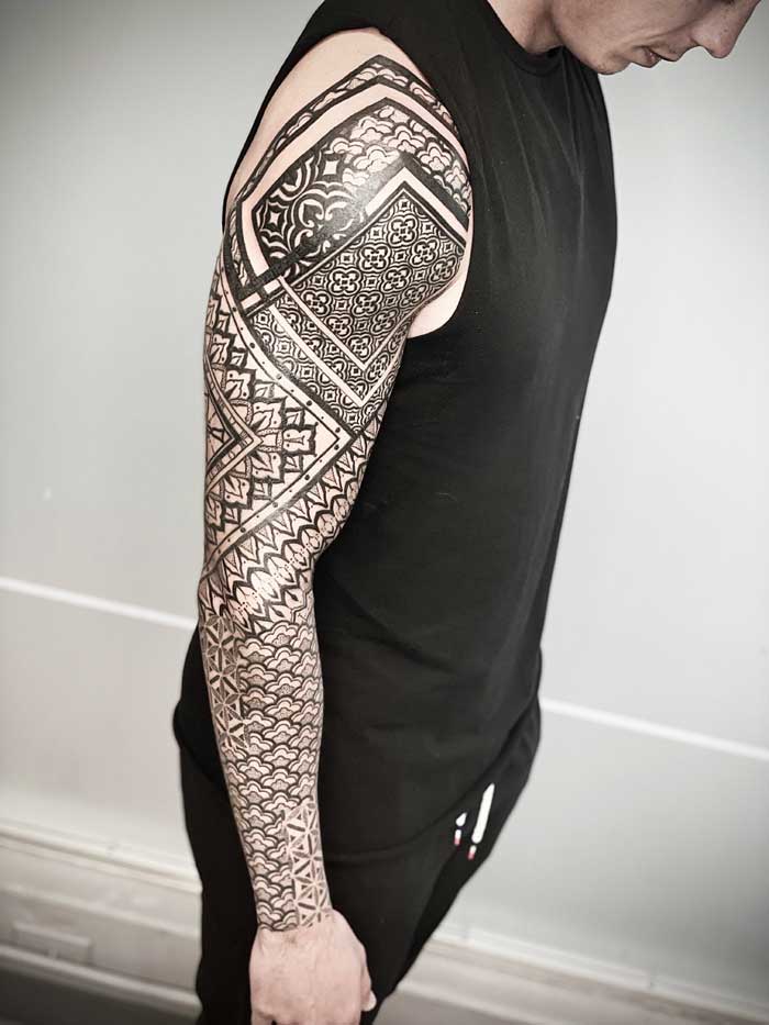 Full sleeve tattoo by Simon Halpern
