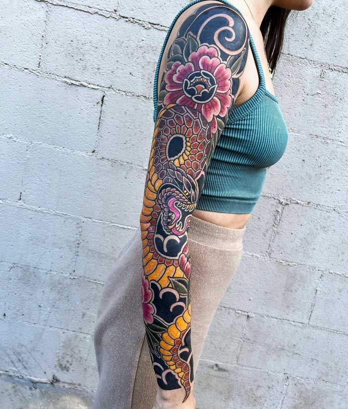 Full sleeve tattoo by Ash