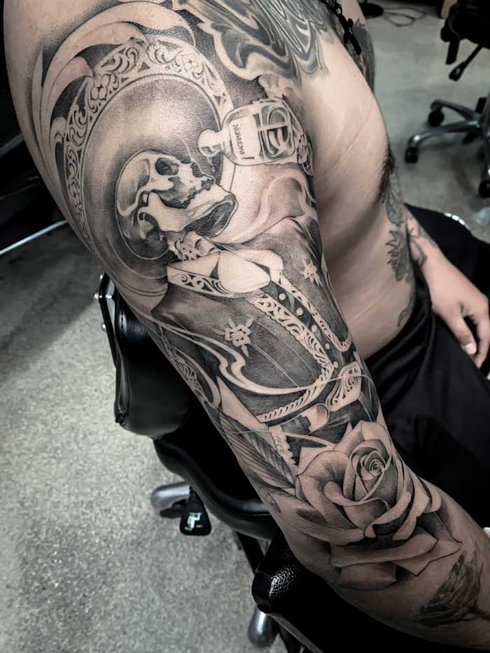 Skeleton arm sleeve tattoo by Vincent