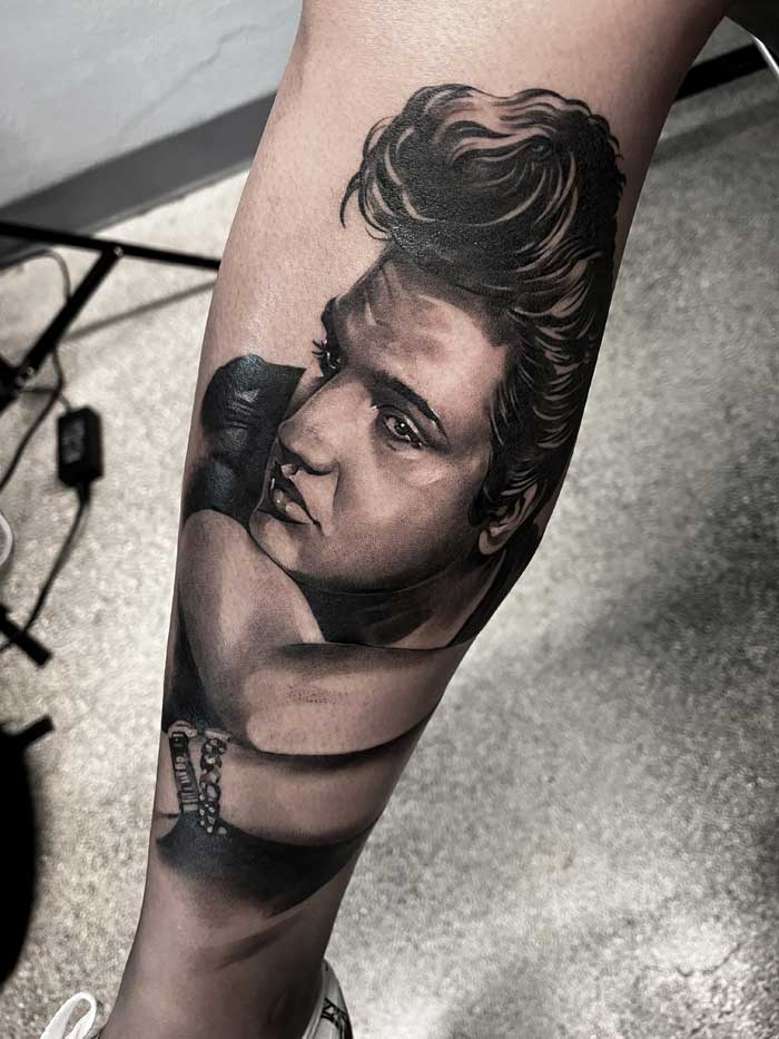 Elvis on calf tattoo by Vincent