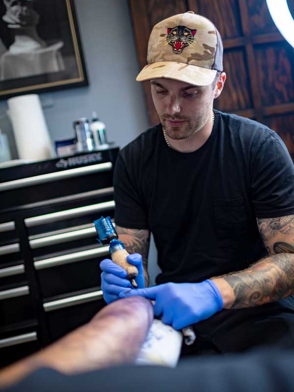 Hunter Schuon - Tattoo artist at 1 Point Tattoo