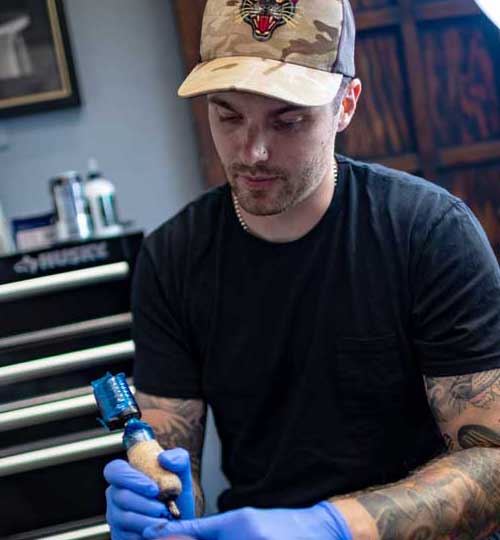 Hunter Schuon tattoo artist at 1 Point Tattoo