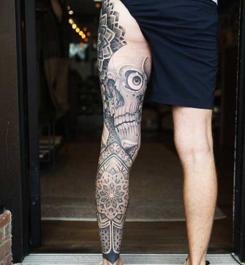 Skull leg sleeve tattoo by Hunter Schuon