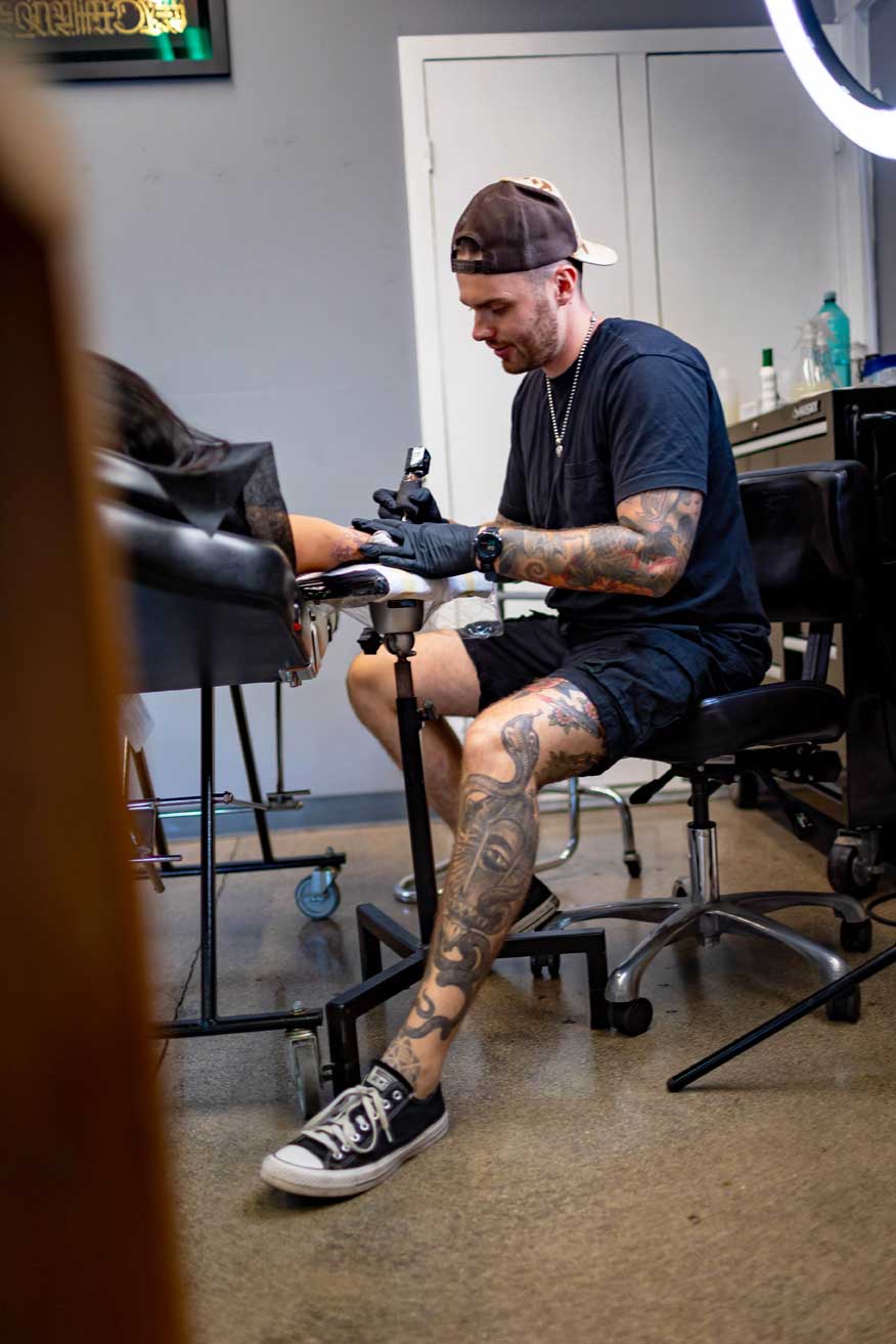 Tattoo artist Hunter Schuon at 1 Point Tattoo